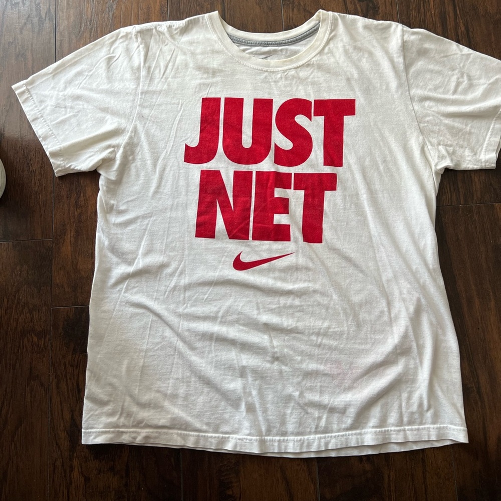 Large size white Nike man’s shirt with red color print